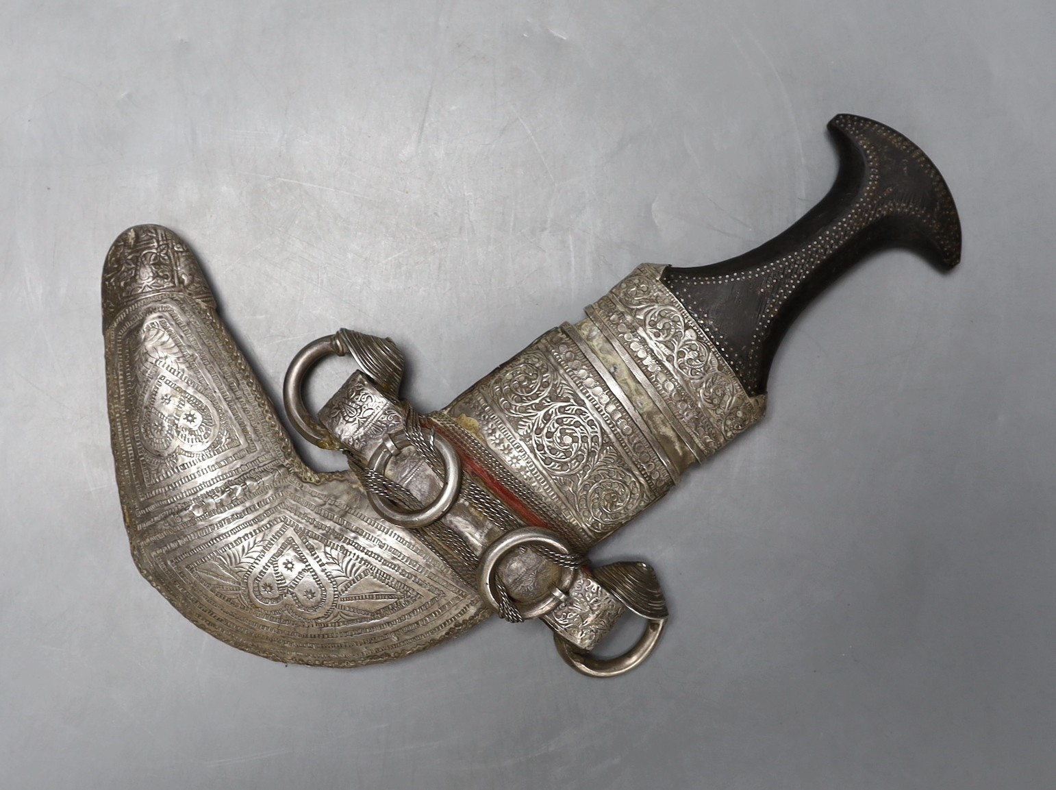 An Arabic white metal overlaid jambiya